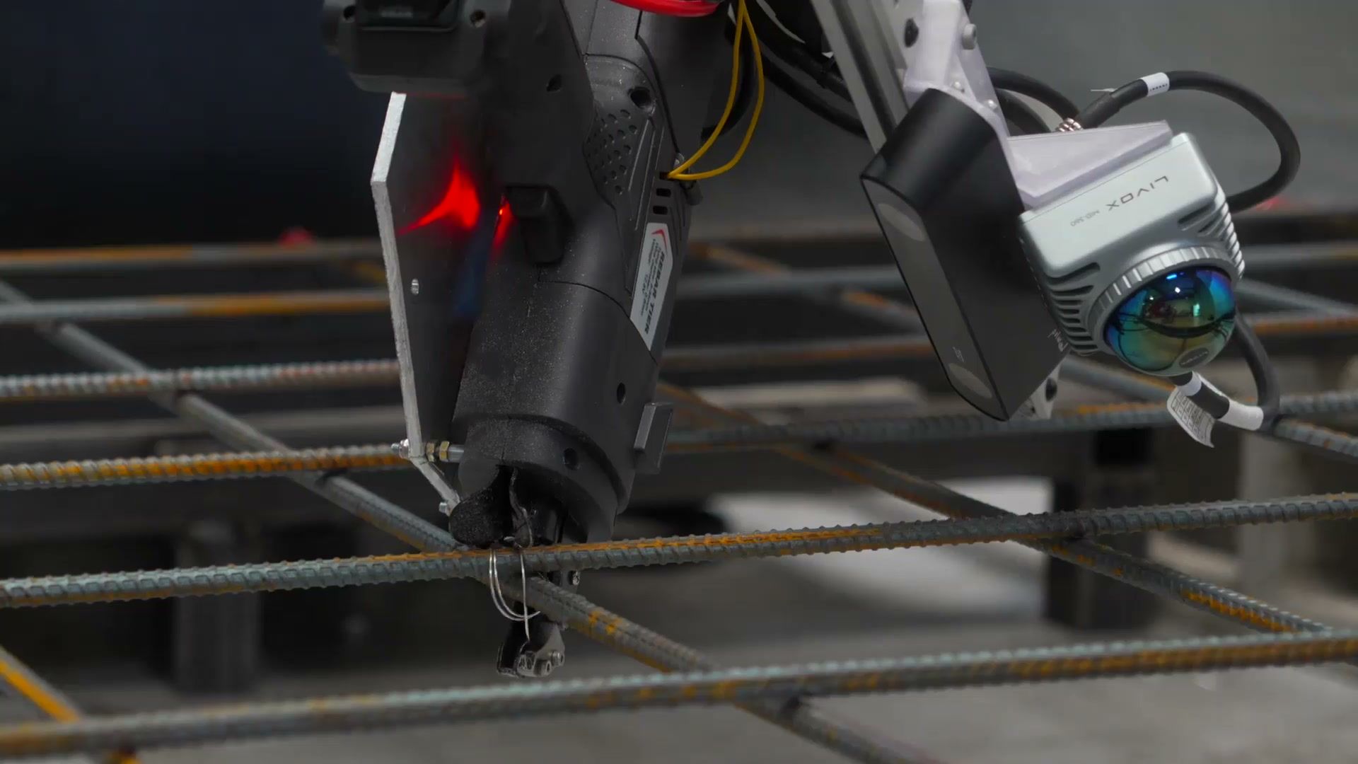 Gritt’s rebar-tying tool and lidar sensor working over a rebar grid