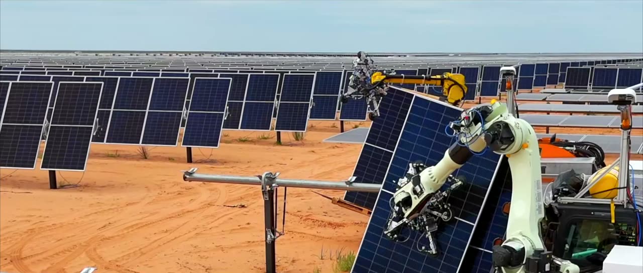Gritt robotic arms placing a solar panel on a utility-scale solar site