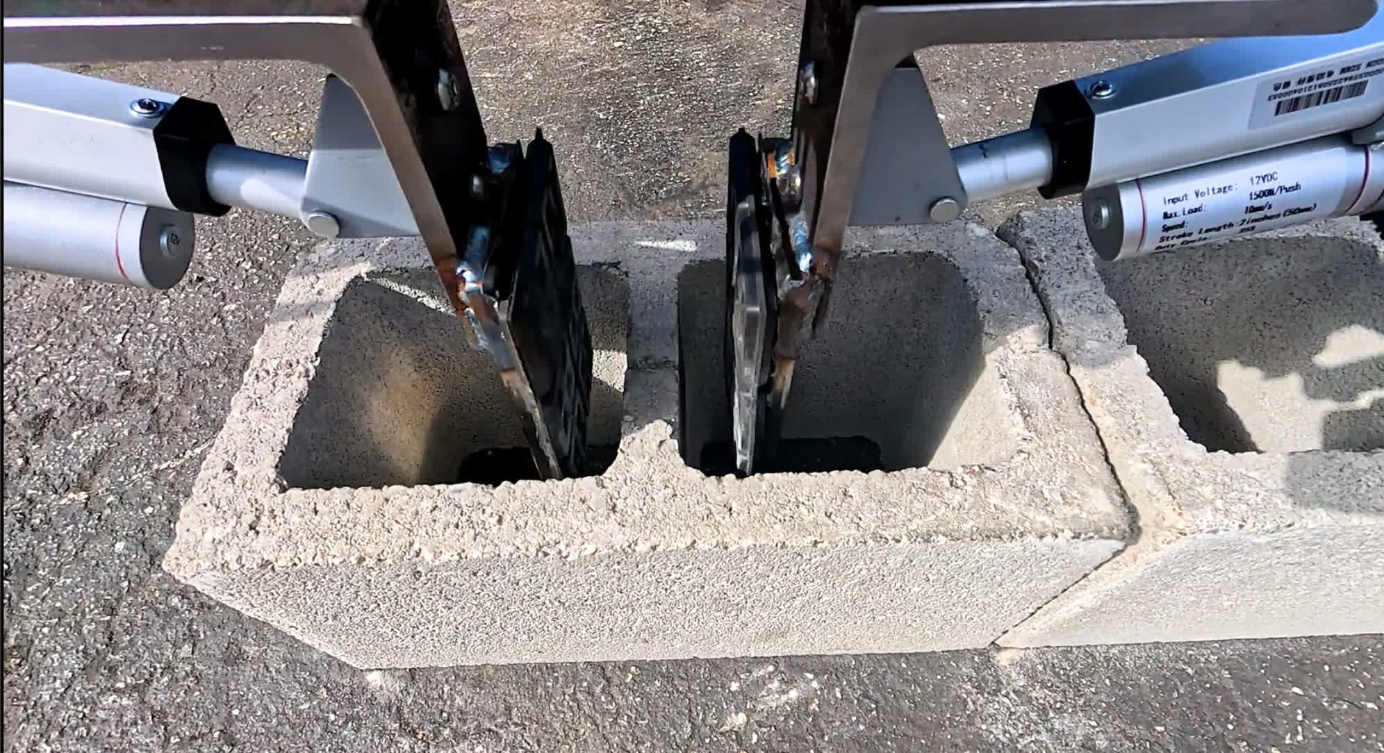 Gritt’s grippers setting a concrete block on a jobsite