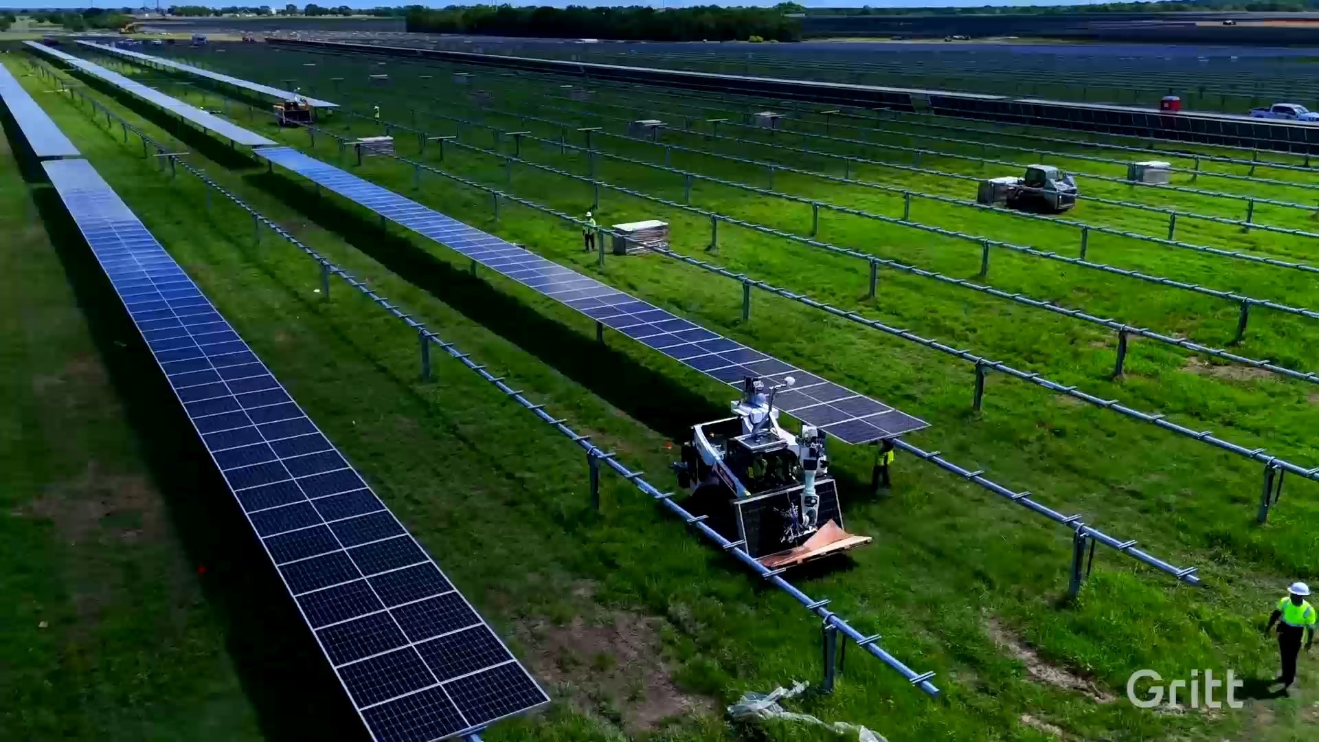 Gritt machine working rows of a solar farm